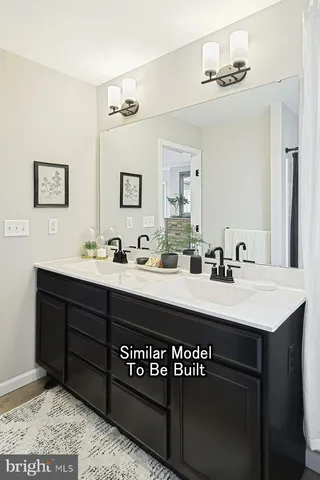 a bathroom with a sink a mirror and a vanity