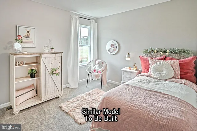 a bedroom with a bed a dresser and decor