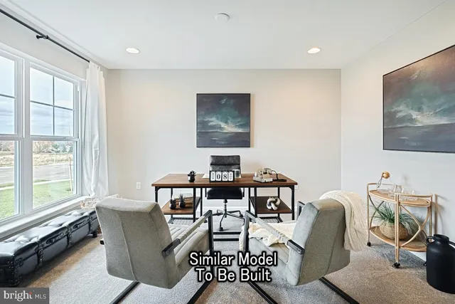 a workspace with furniture and window