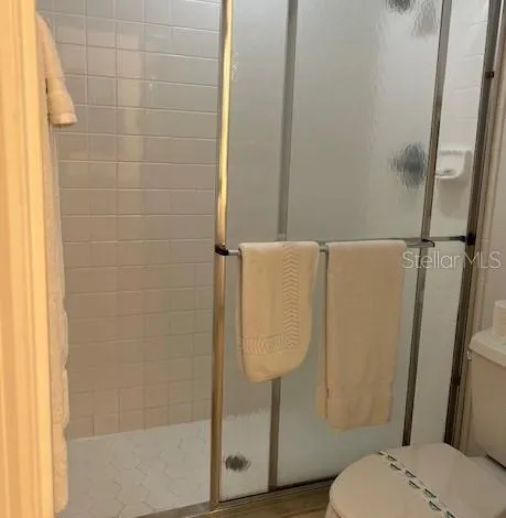 a view of a balcony dining area with furniture