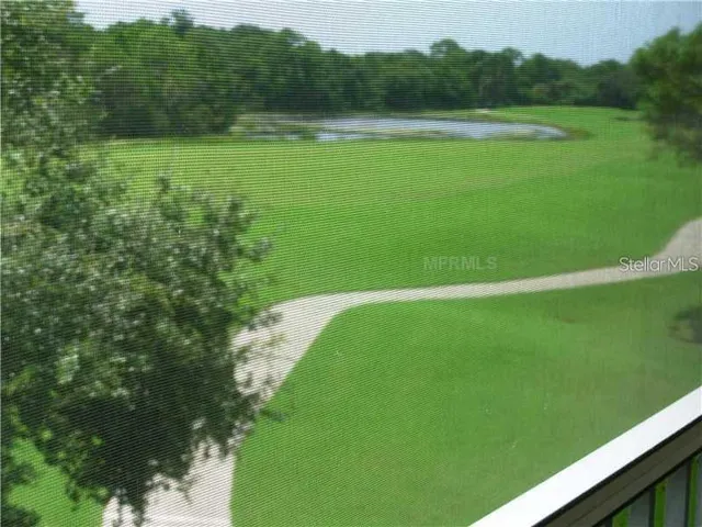 a view of a house with potted plants