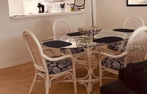 a living room with furniture and a painting