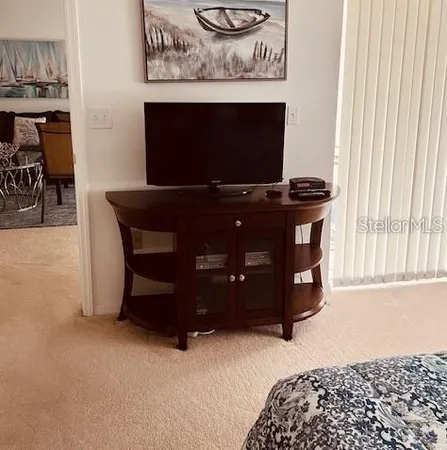 a bedroom with bed and window