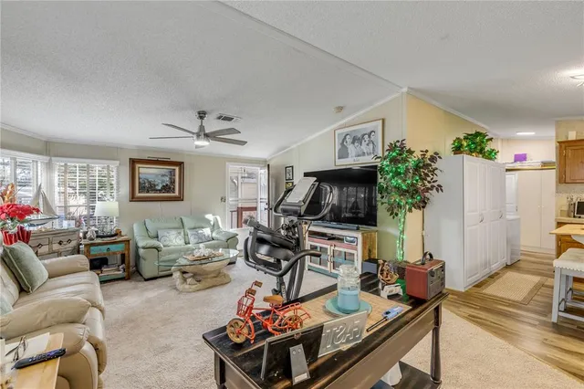 a kitchen with stainless steel appliances a stove a sink and a microwave