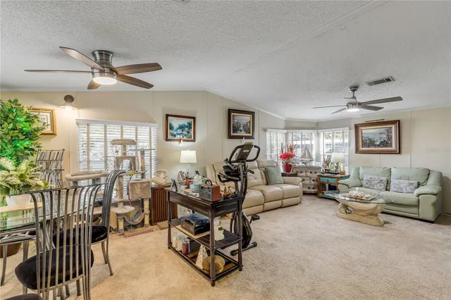 a kitchen with stainless steel appliances kitchen island granite countertop a sink and cabinets