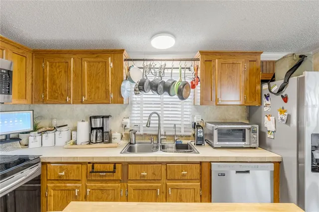 a work room with furniture windows and a flat screen tv