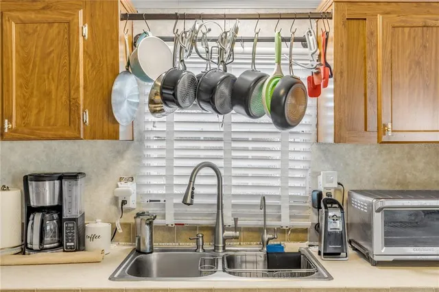 a bathroom with a granite countertop sink mirror vanity and toilet