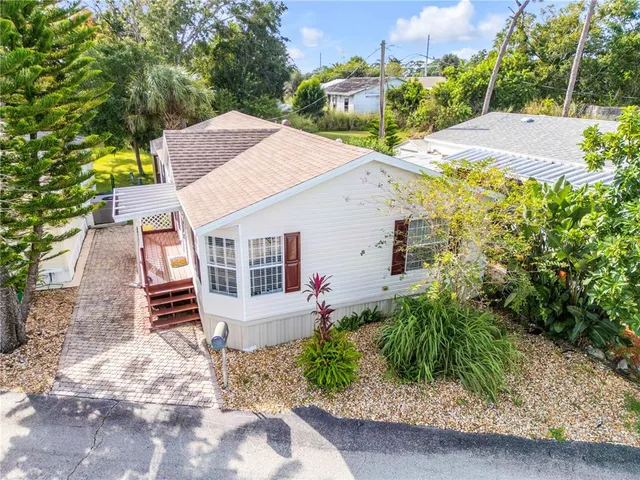 a bed room with a bed and a painting on the wall