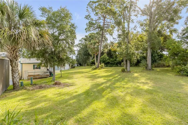 a kitchen with granite countertop stainless steel appliances a refrigerator and a stove top oven