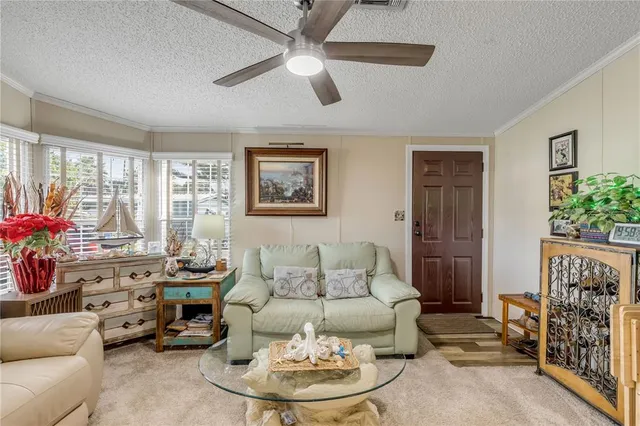 a bedroom with a bed a couch and a window