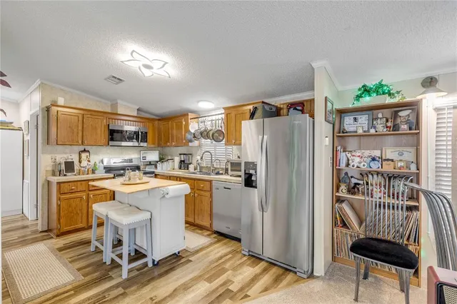 a living room with furniture a rug and a ceiling fan