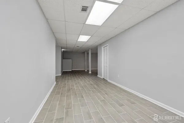 a view of a room with a white wall