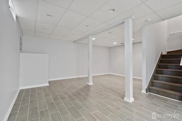 a view of an empty room with stairs