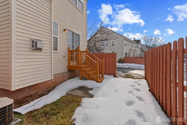 a view of a house with a snow in the yard