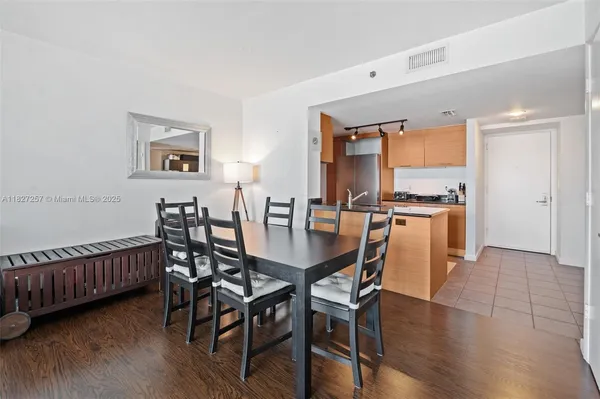 a view of a dining room with furniture and wooden floor