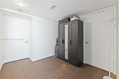 a view of a hallway with closet area