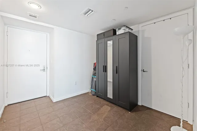 a view of a hallway with closet area