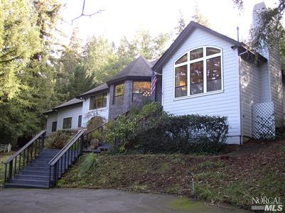 2172 Green Hill Road Sebastopol, CA 95472 - Photo 1 of 12 a front view of house with yard and trees around