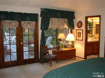 2172 Green Hill Road Sebastopol, CA 95472 - Photo 10 of 12 a living room with furniture and a floor to ceiling window