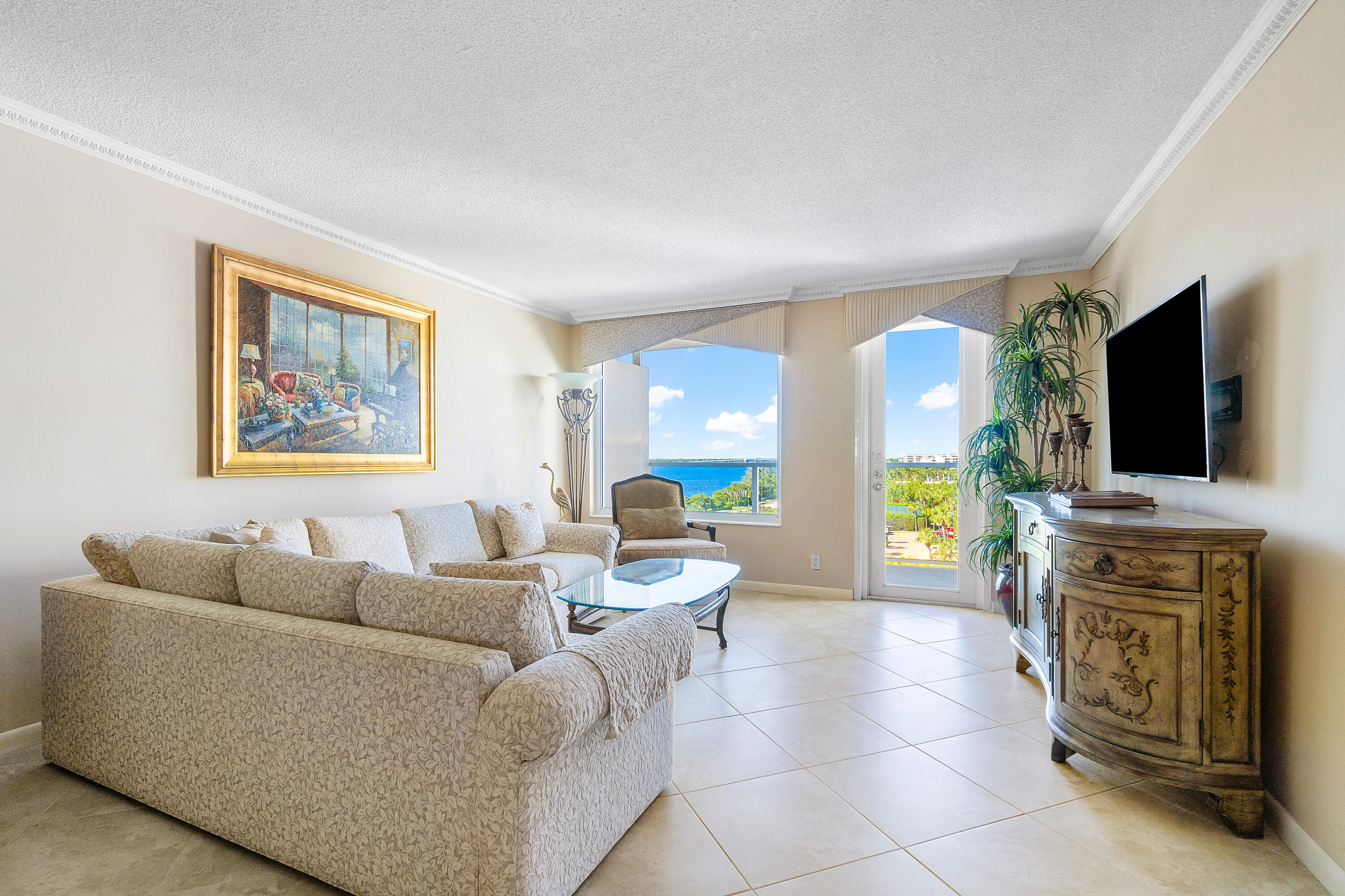 3450 South Ocean Boulevard, Unit 625 Palm Beach, FL 33480 - Photo 1 of 43 a living room with furniture and a flat screen tv