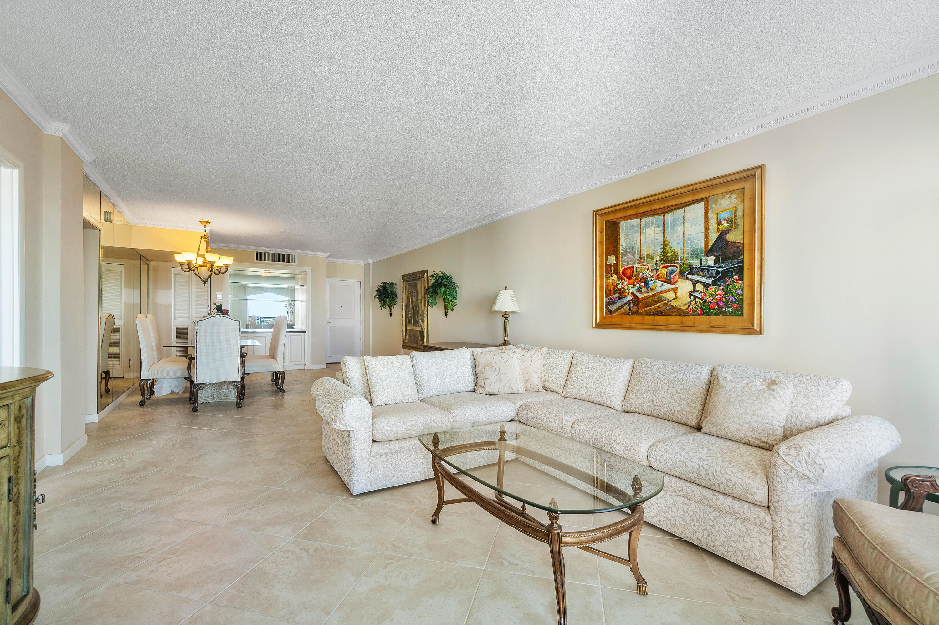 3450 South Ocean Boulevard, Unit 625 Palm Beach, FL 33480 - Photo 43 of 43 a living room with furniture and a painting on the wall