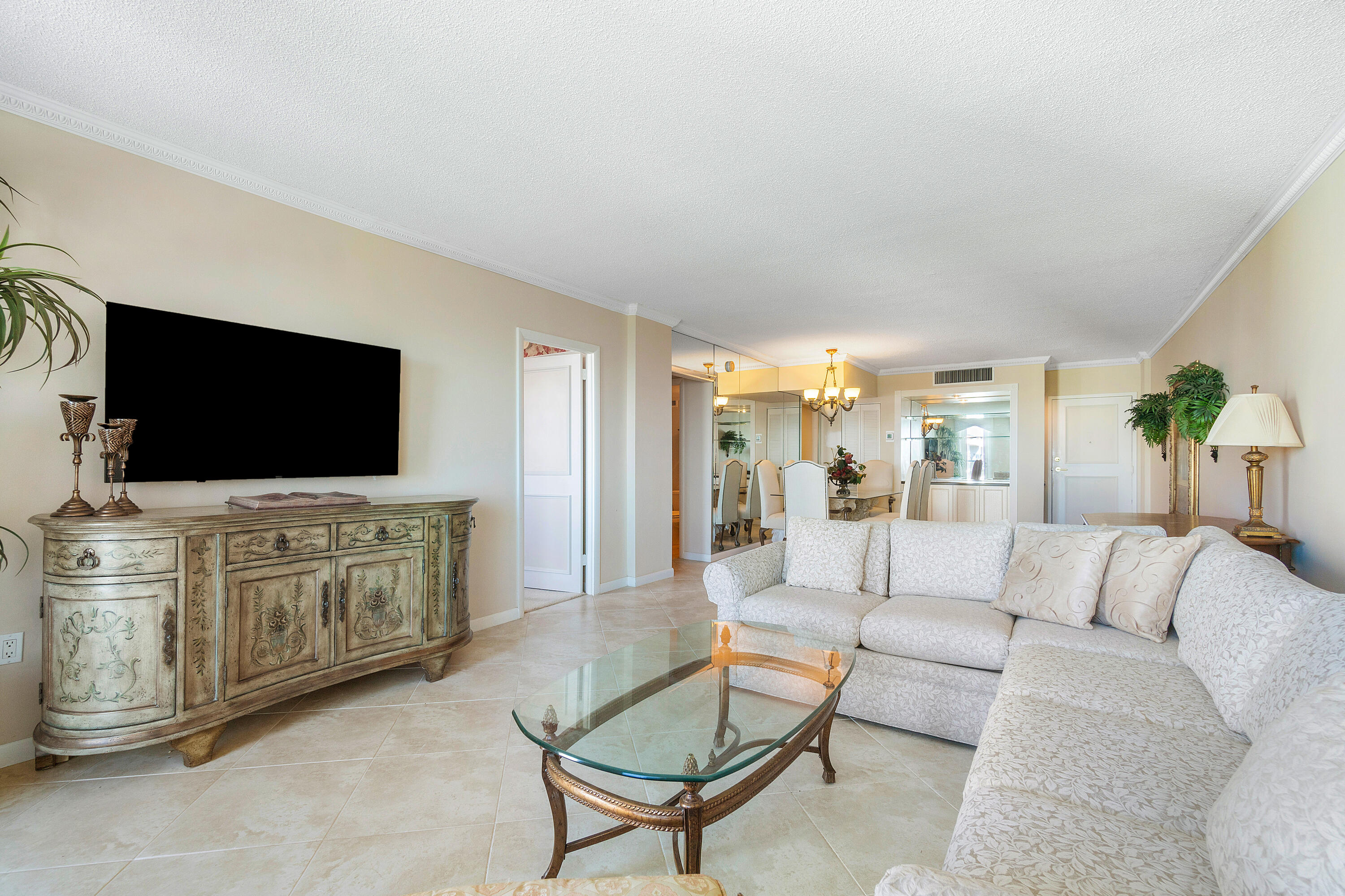 3450 South Ocean Boulevard, Unit 625 Palm Beach, FL 33480 - Photo 11 of 43 a living room with furniture and a flat screen tv