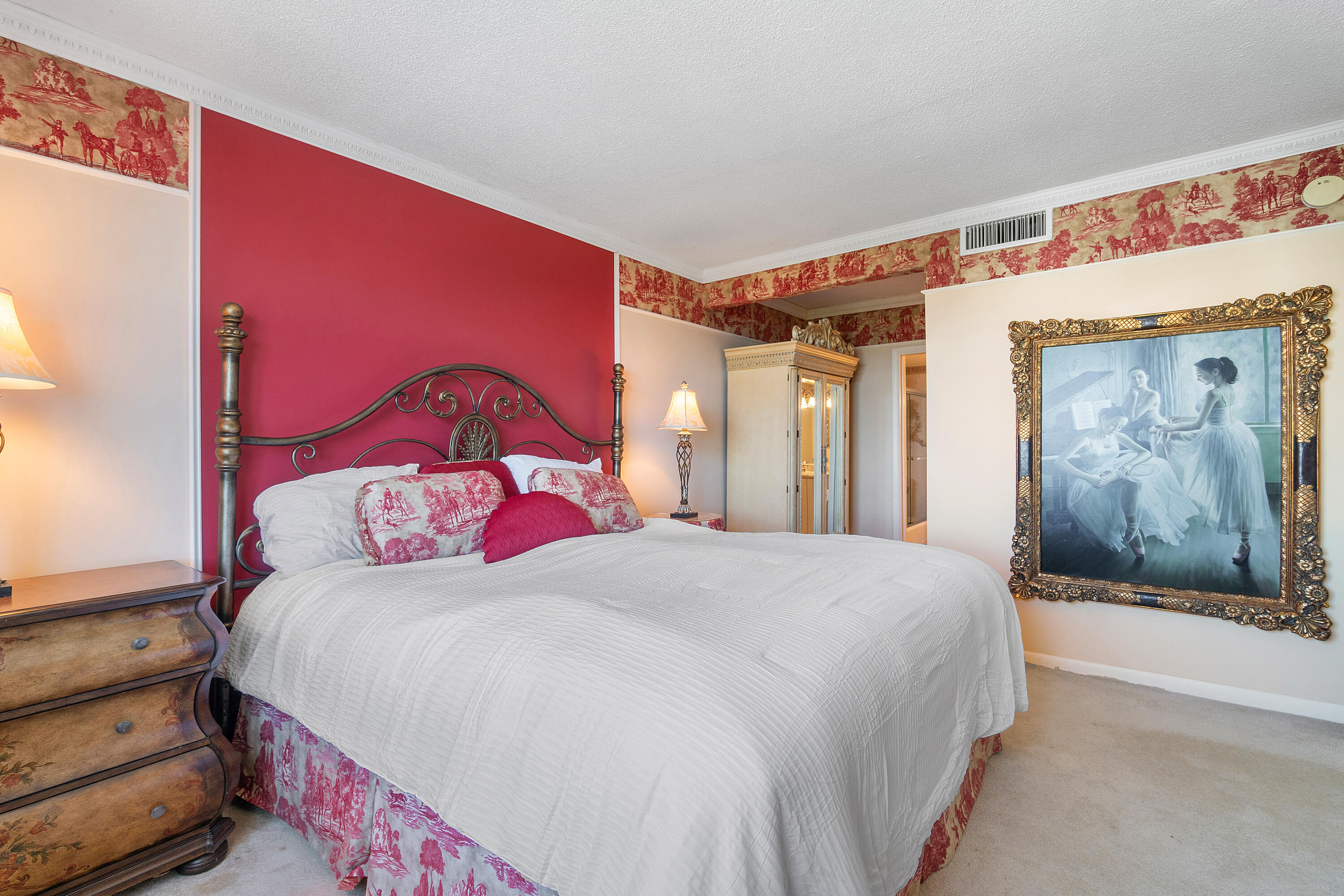 3450 South Ocean Boulevard, Unit 625 Palm Beach, FL 33480 - Photo 18 of 43 a bedroom with a bed and a painting on the wall