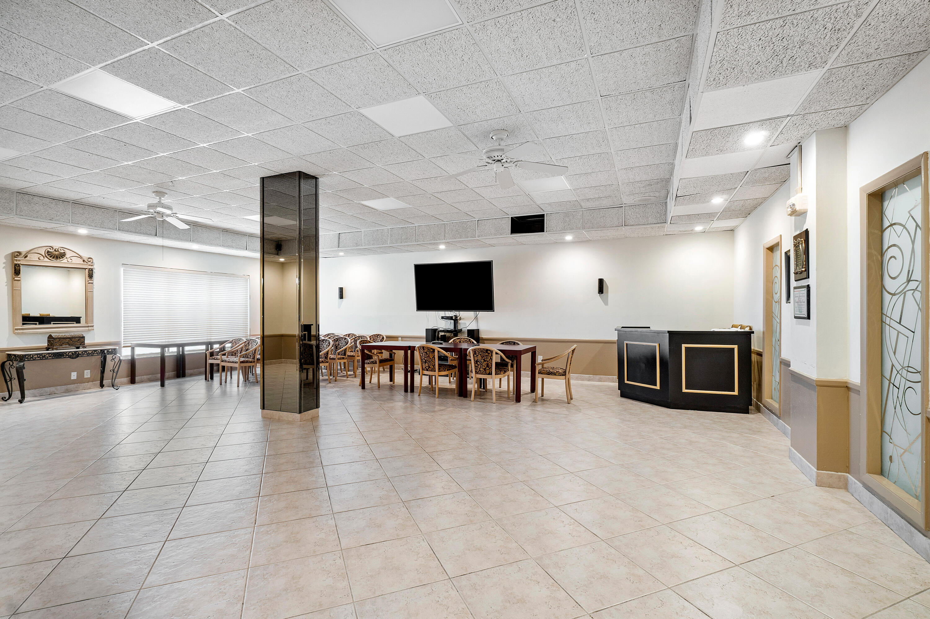 3450 South Ocean Boulevard, Unit 625 Palm Beach, FL 33480 - Photo 30 of 43 a lobby with furniture and flat screen tv