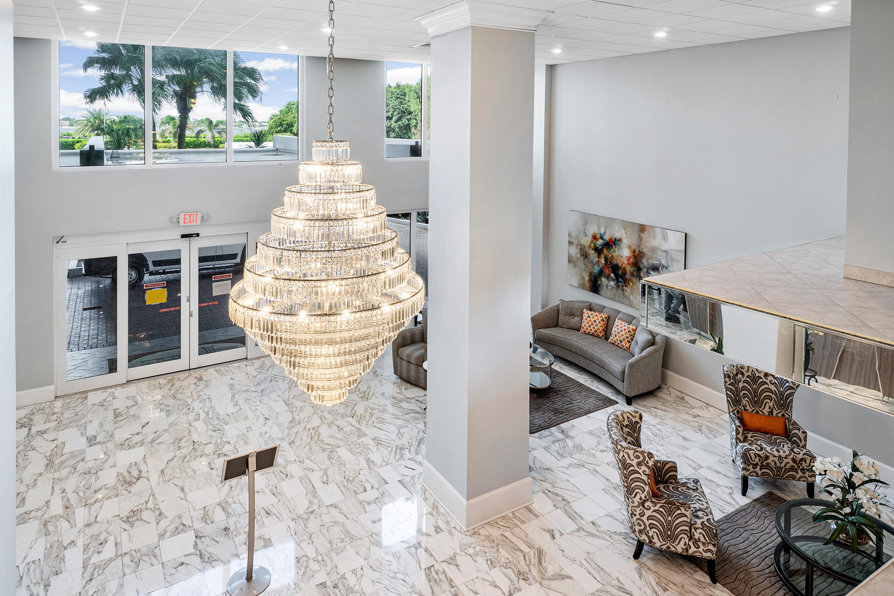 3450 South Ocean Boulevard, Unit 625 Palm Beach, FL 33480 - Photo 37 of 43 a living room with furniture and a chandelier