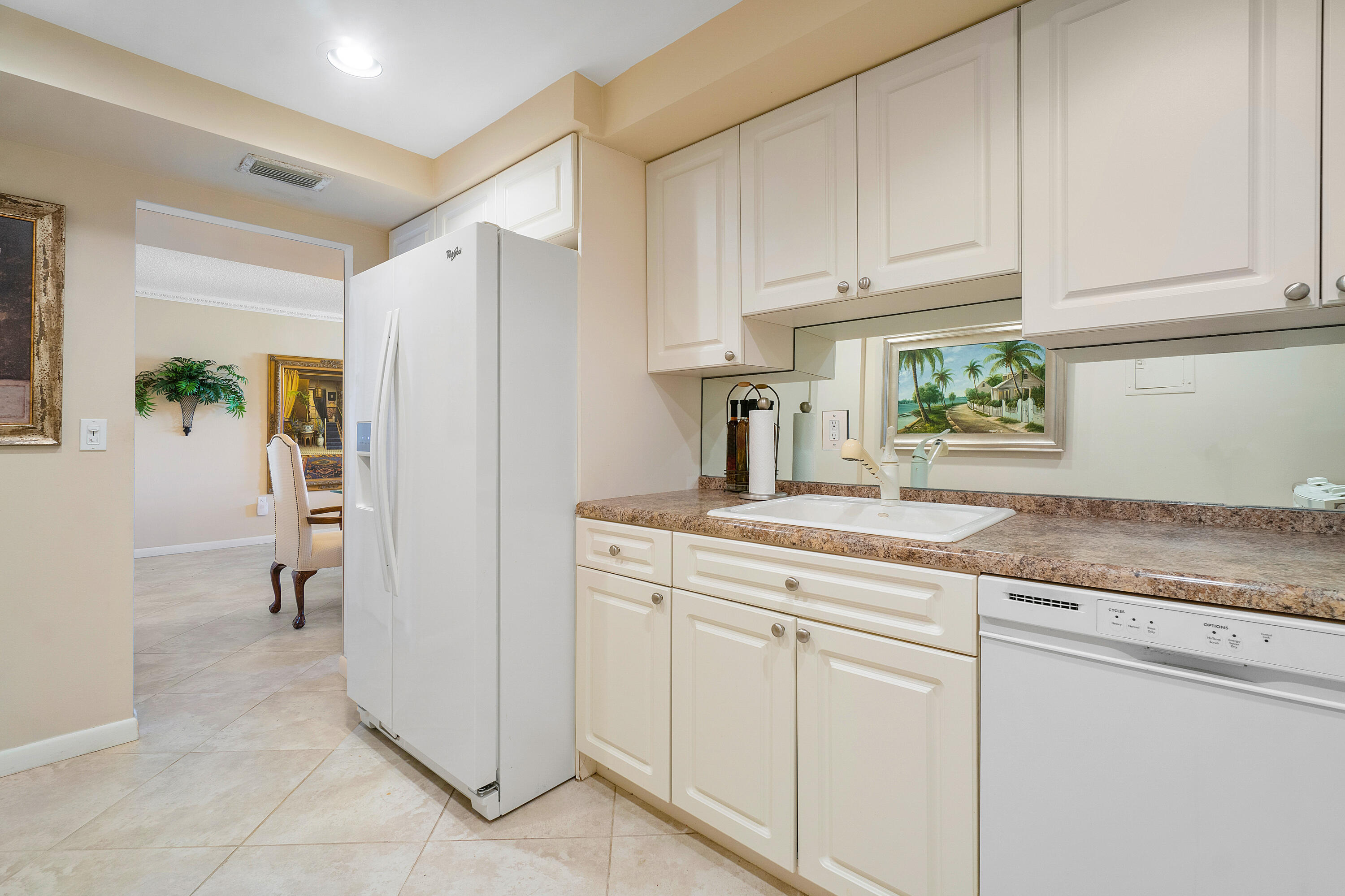 3450 South Ocean Boulevard, Unit 625 Palm Beach, FL 33480 - Photo 8 of 43 a kitchen with a sink and cabinets