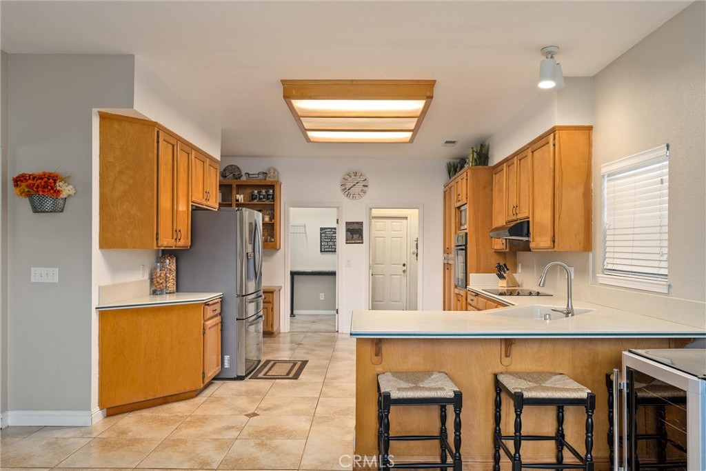 3385 Keefer Road Chico, CA 95973 - Photo 12 of 40 a kitchen with stainless steel appliances granite countertop a sink and a refrigerator