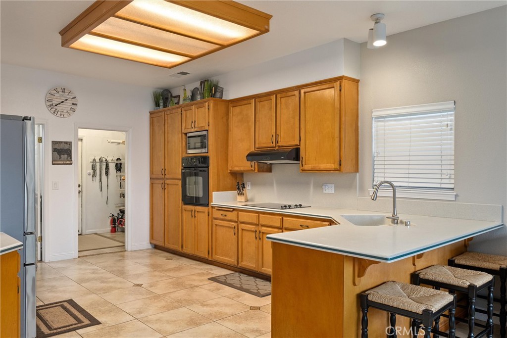 3385 Keefer Road Chico, CA 95973 - Photo 13 of 40 a kitchen with a sink refrigerator and cabinets