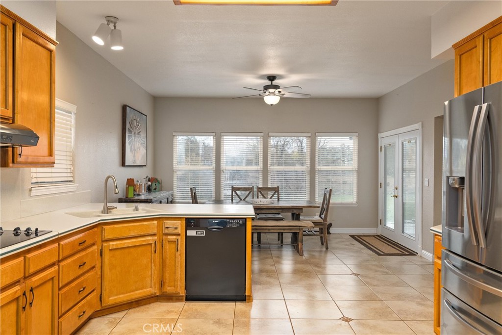 3385 Keefer Road Chico, CA 95973 - Photo 15 of 40 a view of a kitchen with stainless steel appliances granite countertop a sink and cabinets