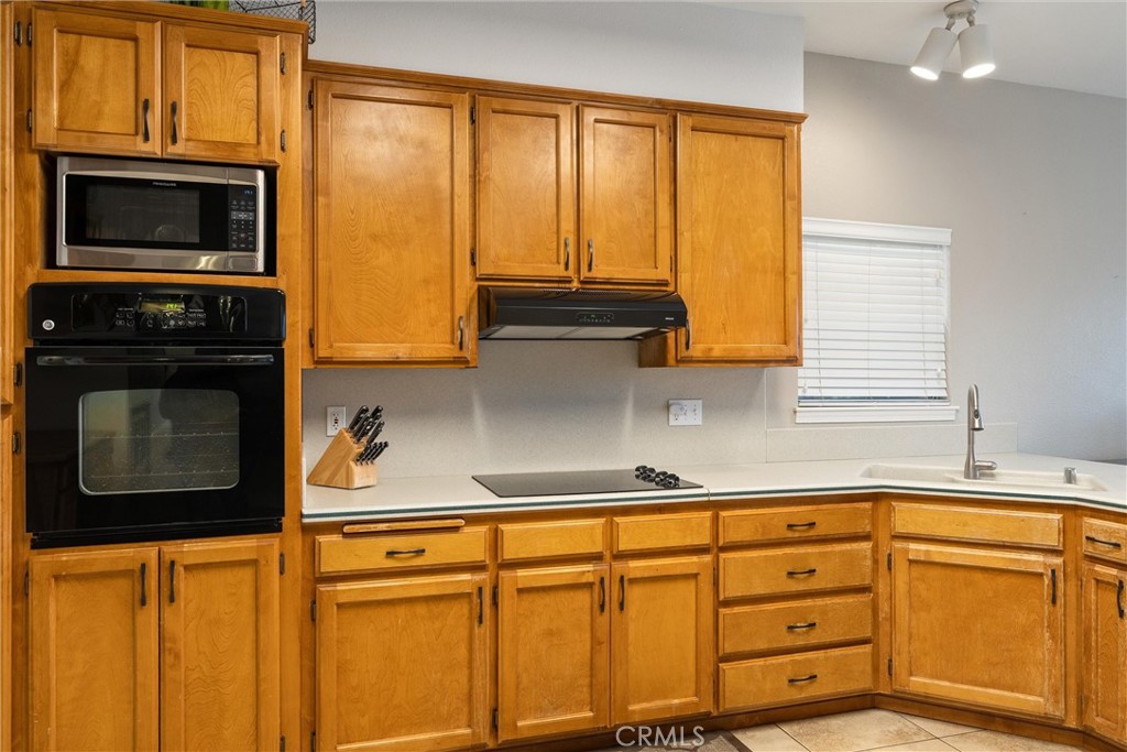 3385 Keefer Road Chico, CA 95973 - Photo 16 of 40 a kitchen with stainless steel appliances a stove sink and microwave