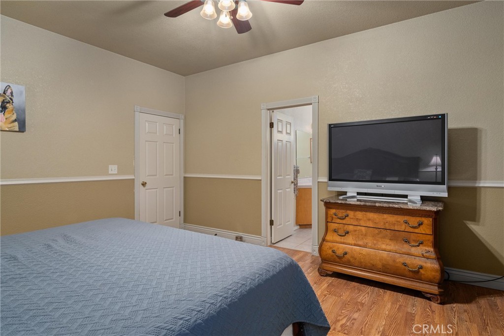 3385 Keefer Road Chico, CA 95973 - Photo 18 of 40 a bedroom with a bed and a flat screen tv