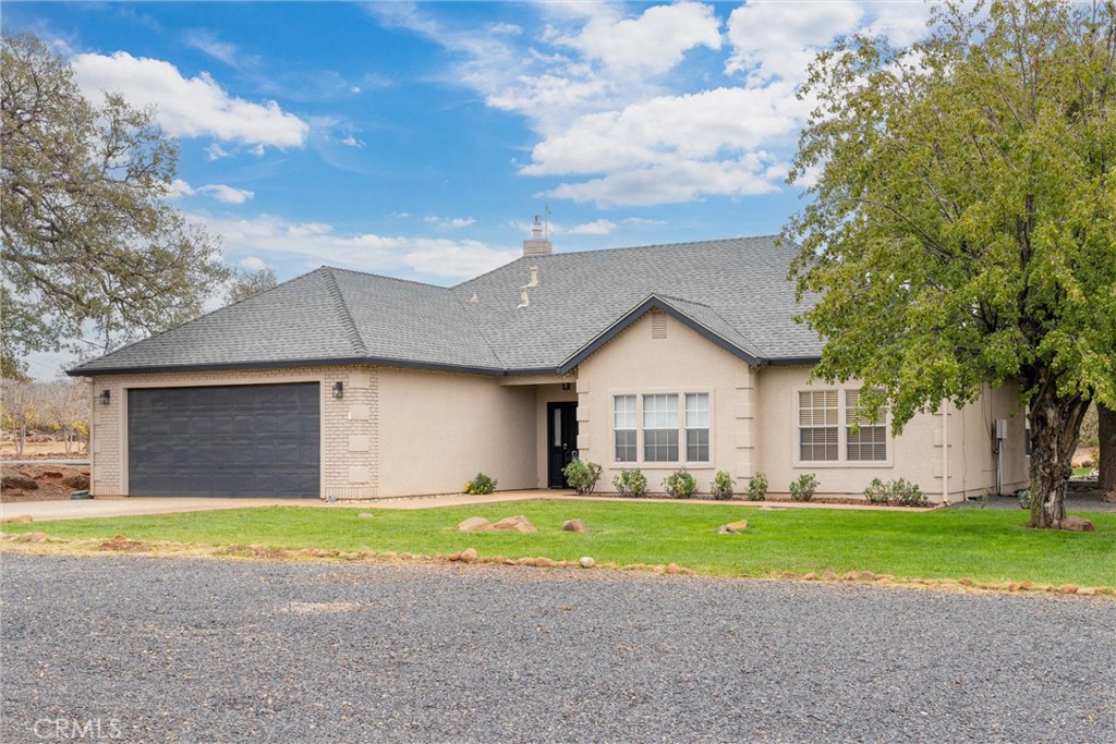 3385 Keefer Road Chico, CA 95973 - Photo 2 of 40 a view of a house with a big yard and large trees