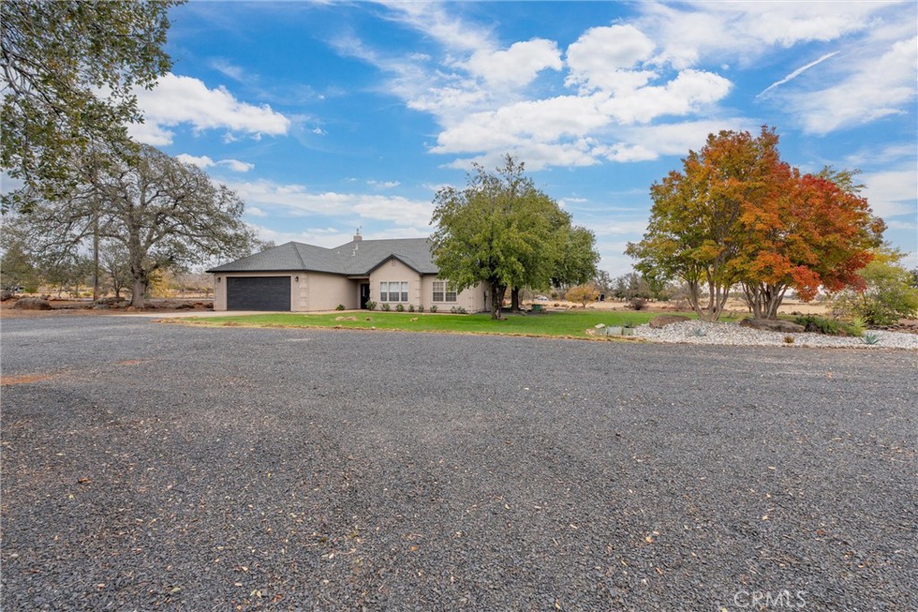 3385 Keefer Road Chico, CA 95973 - Photo 27 of 40 a view of a house with a big yard and large trees