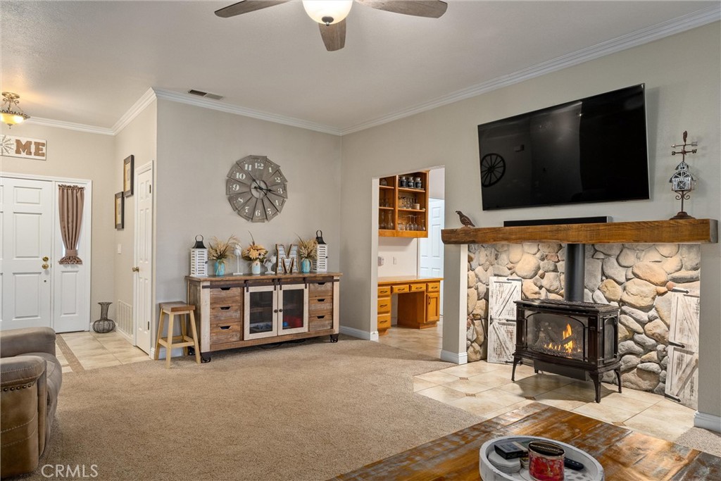 3385 Keefer Road Chico, CA 95973 - Photo 10 of 40 a living room with furniture a flat screen tv and a fireplace