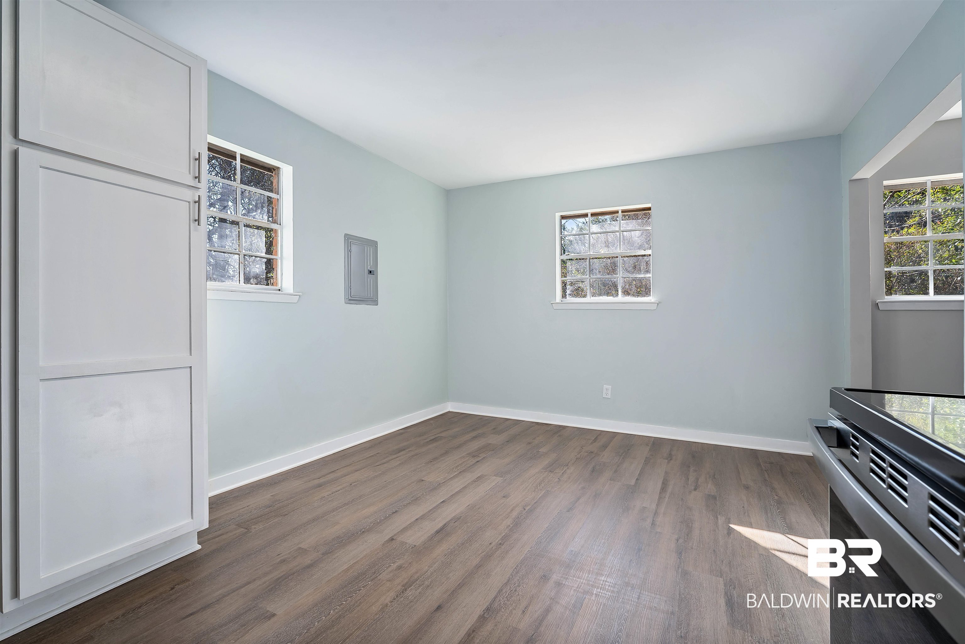 1368 Hubert Pierce Road Mobile, AL 36608 - Photo 12 of 25 Empty room with dark wood-type flooring and electric panel
