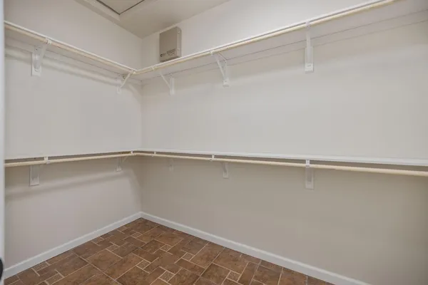 a view of an empty walk in closet