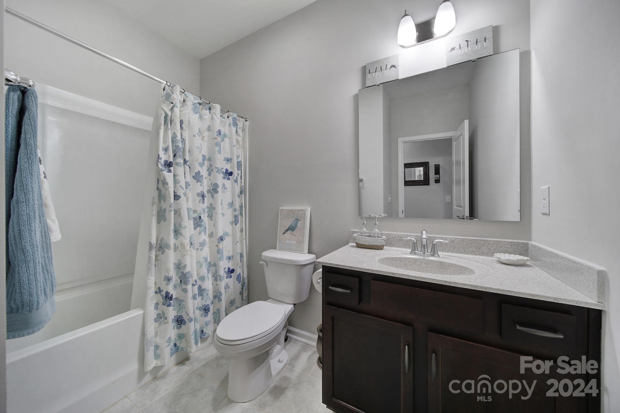 27443 Cinderella Circle Lancaster, SC 29720 - Photo 19 of 37 a bathroom with a sink a toilet and shower