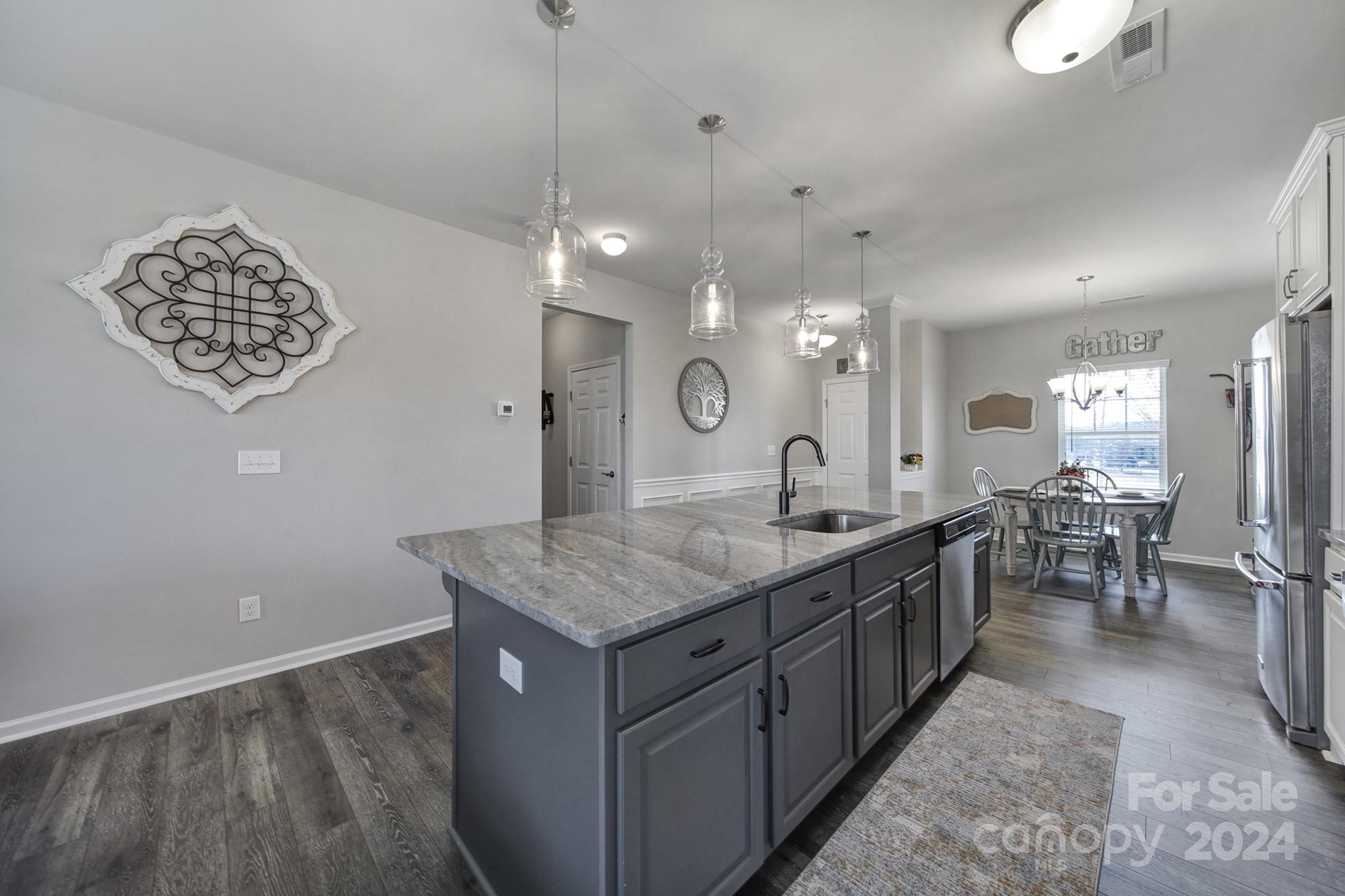 27443 Cinderella Circle Lancaster, SC 29720 - Photo 3 of 37 a bathroom with a granite countertop sink a toilet and a mirror