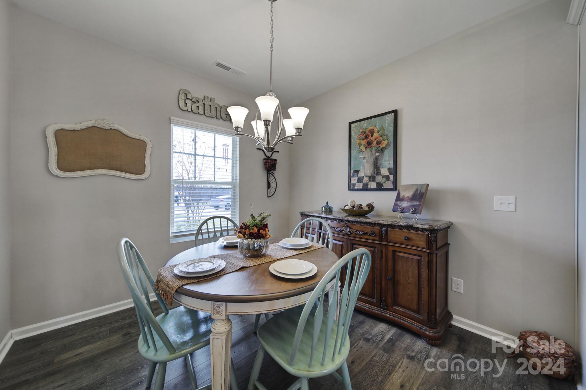 27443 Cinderella Circle Lancaster, SC 29720 - Photo 8 of 37 a view of a dining room with furniture and wooden floor