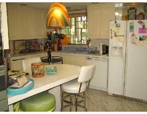 a dining room with furniture and a chandelier