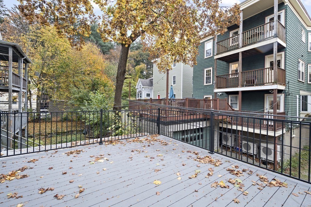 75 Tower Street, Unit 2 Boston, MA 02130 - Photo 11 of 15 a view of a roof deck with wooden fence