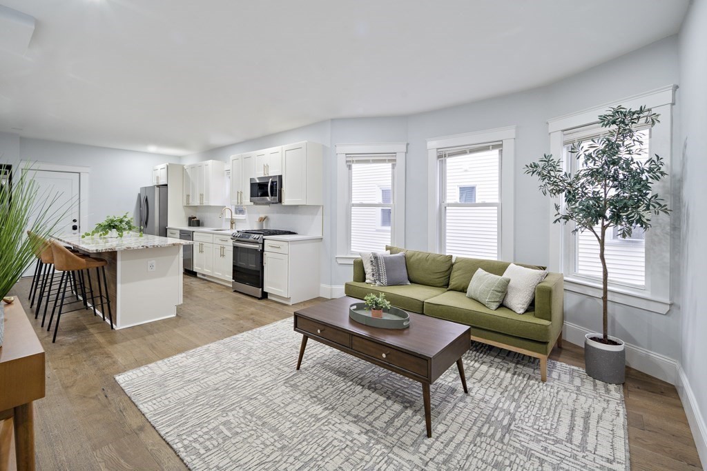 75 Tower Street, Unit 2 Boston, MA 02130 - Photo 5 of 15 a living room with furniture and a fireplace