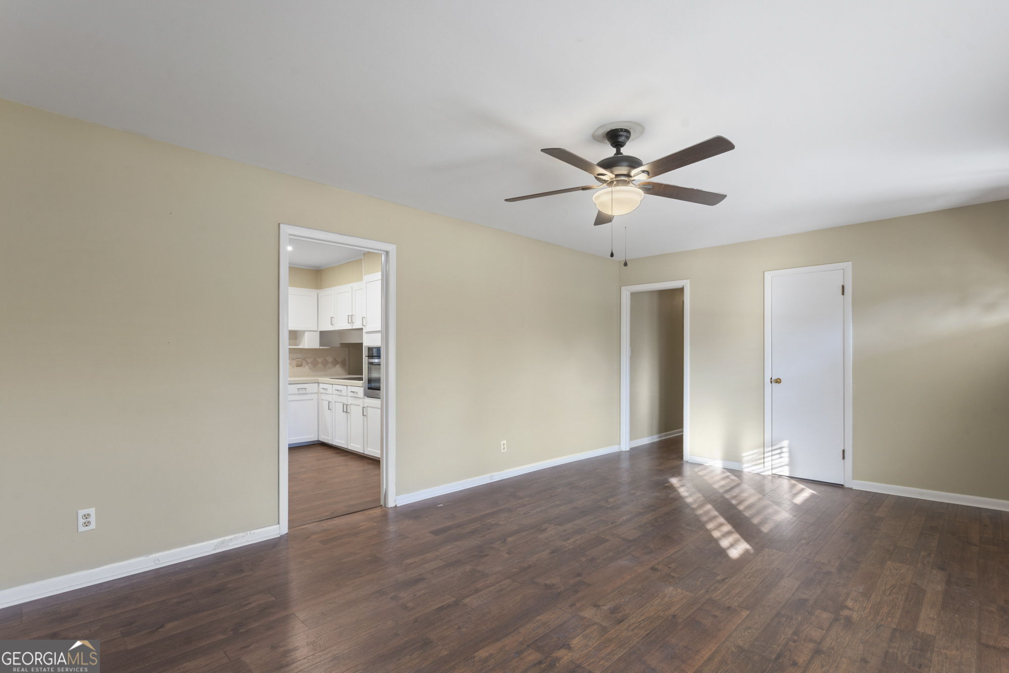 1423 Tucker Road Perry, GA 31069 - Photo 14 of 37 an empty room with cabinet and a ceiling fan