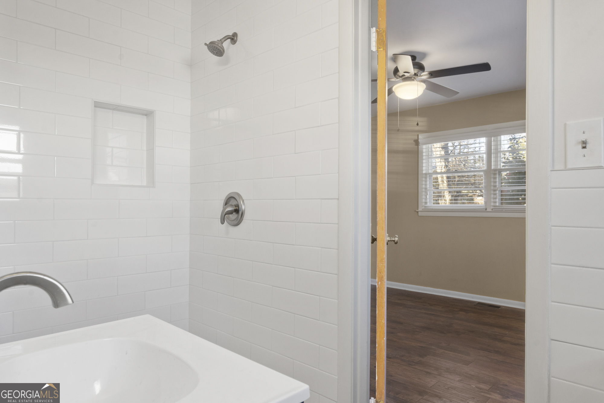 1423 Tucker Road Perry, GA 31069 - Photo 16 of 37 a bathroom with a sink and shower