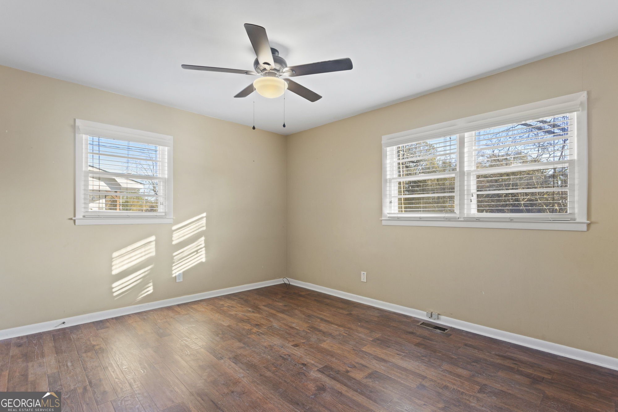 1423 Tucker Road Perry, GA 31069 - Photo 22 of 37 a view of empty room with wooden floor and fan