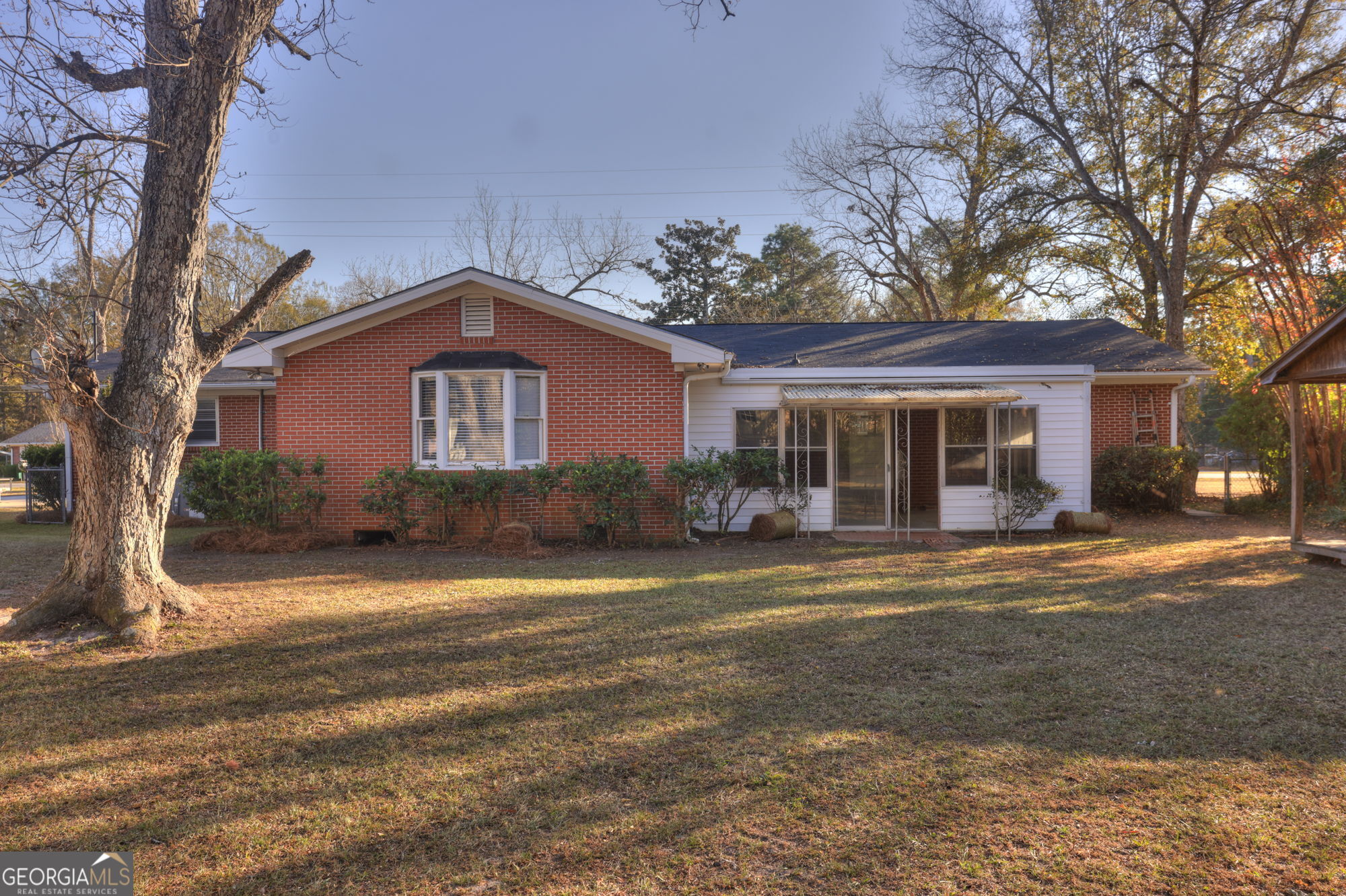 1423 Tucker Road Perry, GA 31069 - Photo 30 of 37 a front view of a house with a yard and garage